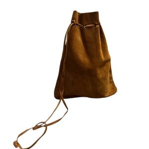 Hand Crafted Women's Suede Drawstring Bucket Bag In a Brown Color.